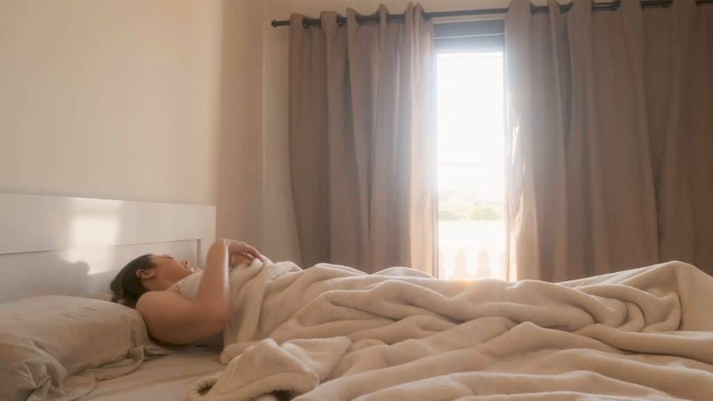 Woman Sleeping in Sunny Room
